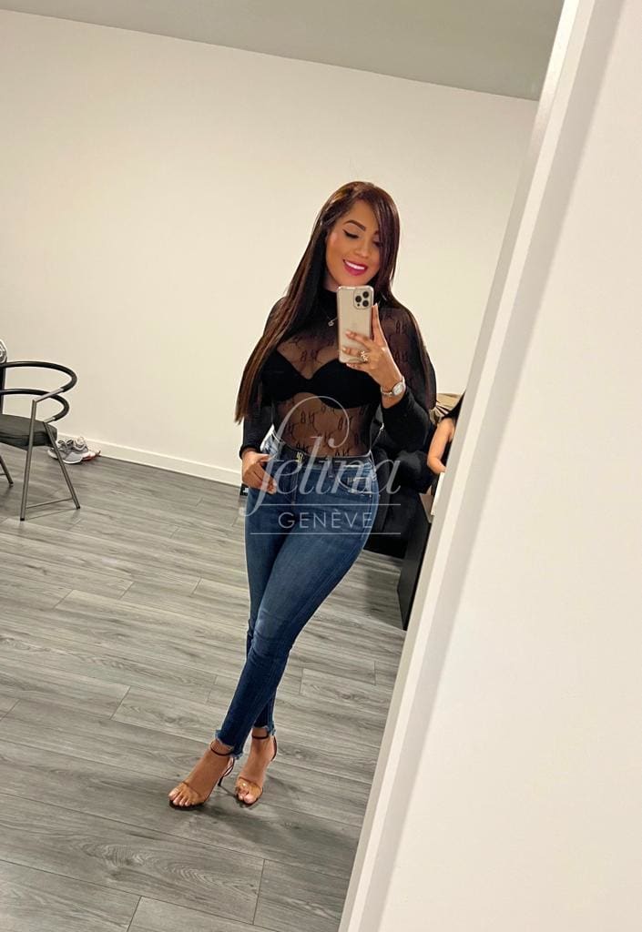 Colombian escort in Geneva for cum in face (CIF), in black blouse, Alejandra